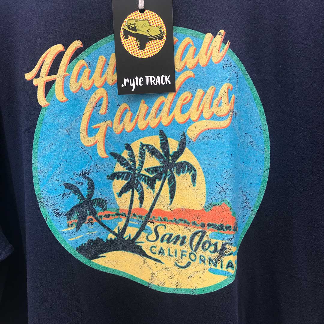Navy blue t-shirt with 'Hawaiian Gardens San Jose California' graphic and a tag on top.