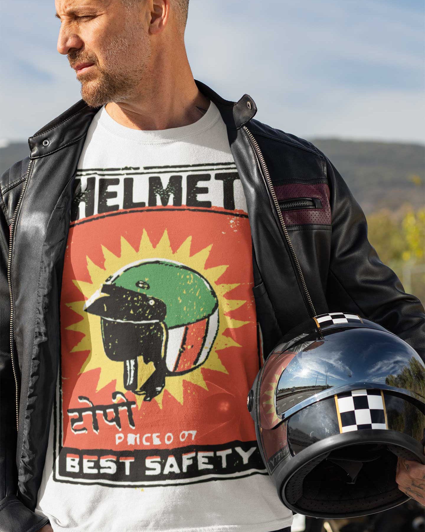 man wearing a t-shirt with motorcycle helmet graphic
