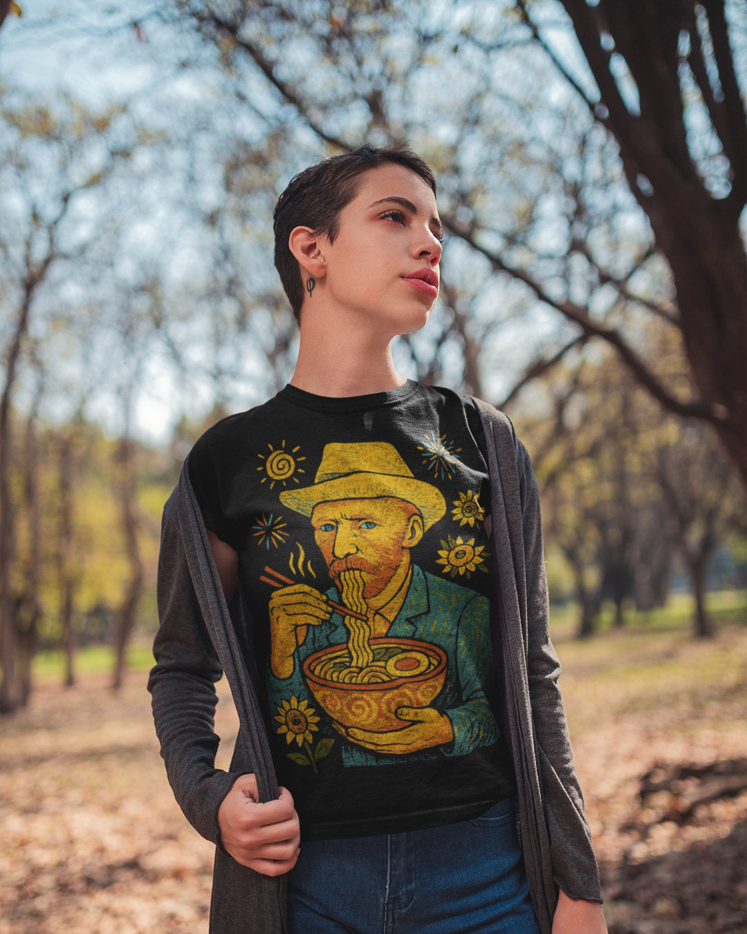 Person wearing a t-shirt with a Van Gogh-inspired design outdoors