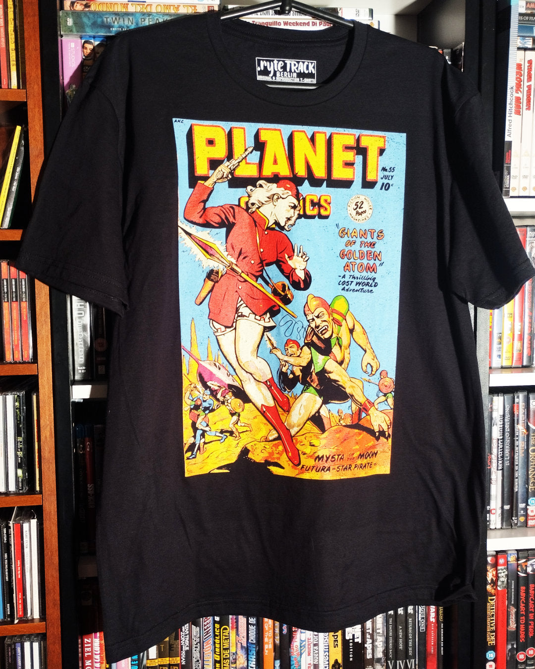 Black t-shirt with a comic book graphic design displayed in front of a bookshelf.