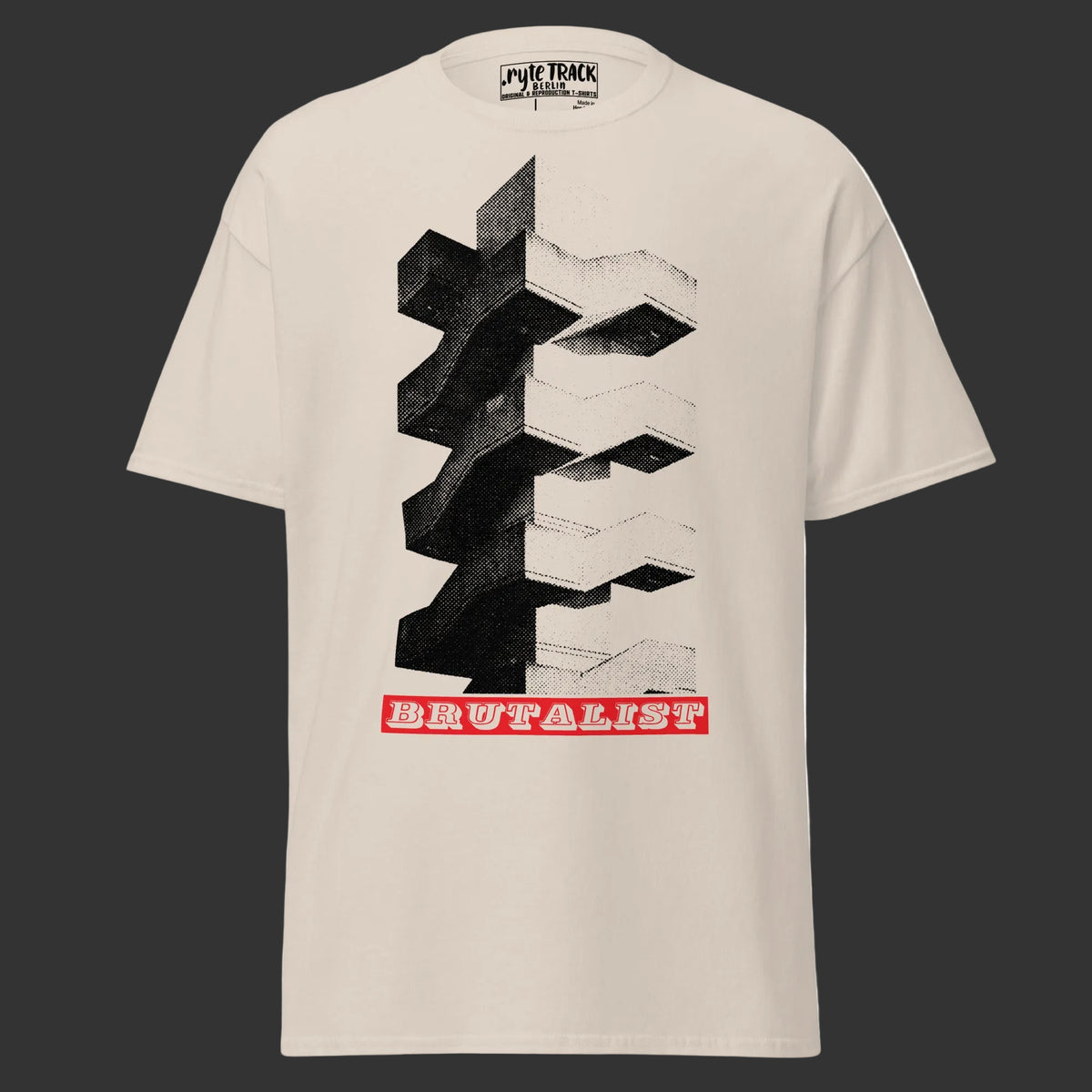 A beige short-sleeve t-shirt with a large graphic print of Brutalist architecture in black and white, featuring a red banner with the word 'BRUTALIST' at the bottom. The brand 'Ryte TRACK' is visible on the inner neck label.
