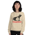 A woman modeling a cream-colored crewneck sweatshirt with a black architectural graphic and a red banner reading 'Brutalist'.