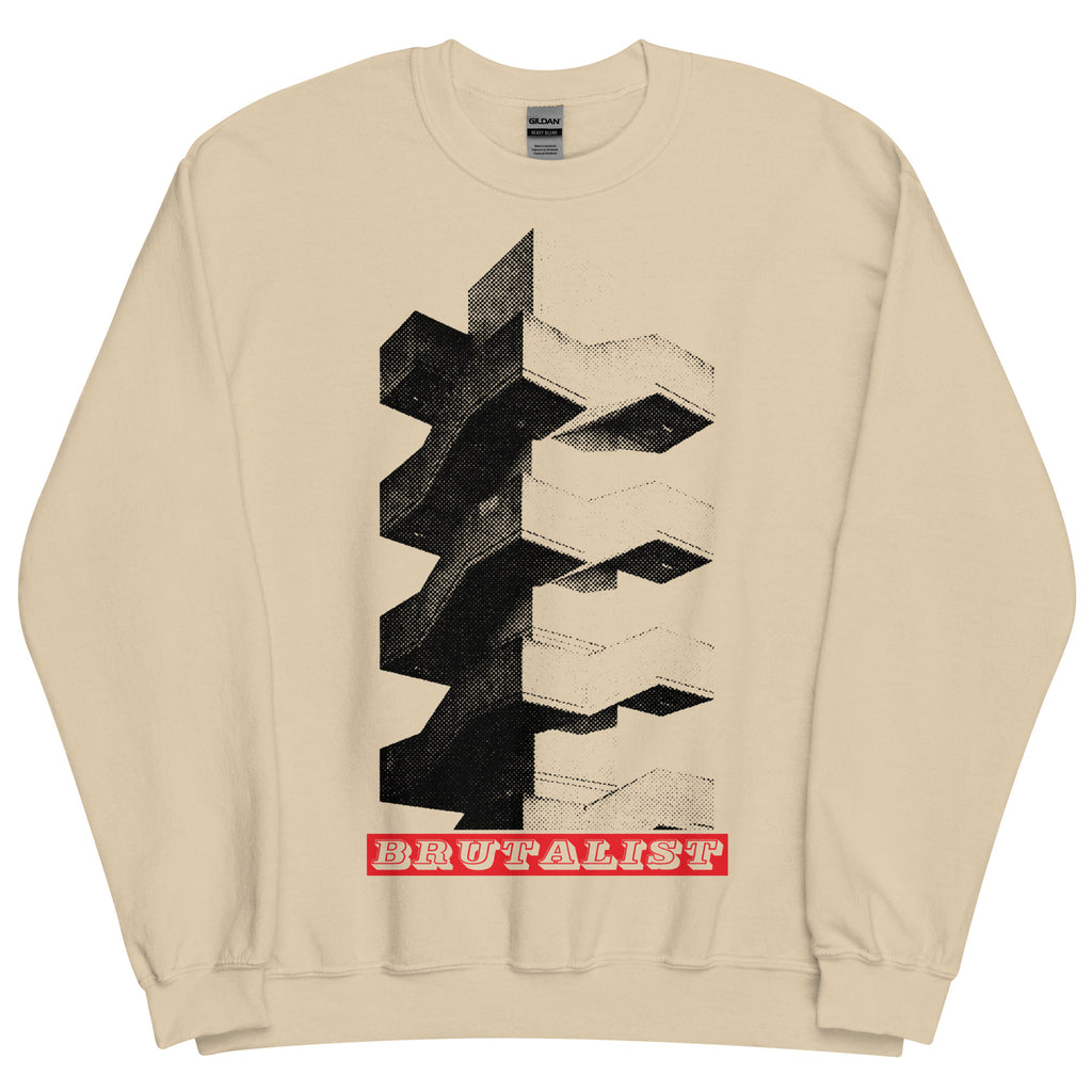 A beige crewneck sweatshirt featuring a black and white Brutalist architectural graphic on the front, with a red banner at the bottom reading 'BRUTALIST'.